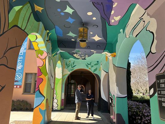 Rep. Peters admires a mural in Liberty Station
