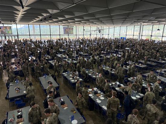 A wide shot of air force academy students in a lunch hall