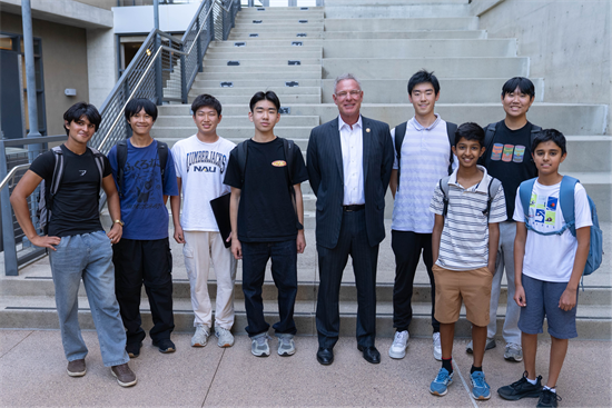Rep. Peters stands with students at his office's 2026 Hackathon event