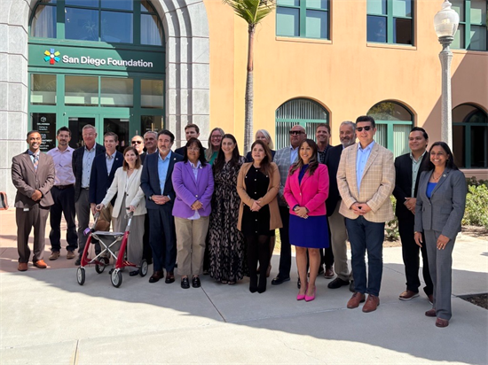 Rep. Peters stands with participants after a roundtable about cross-border sewage pollution