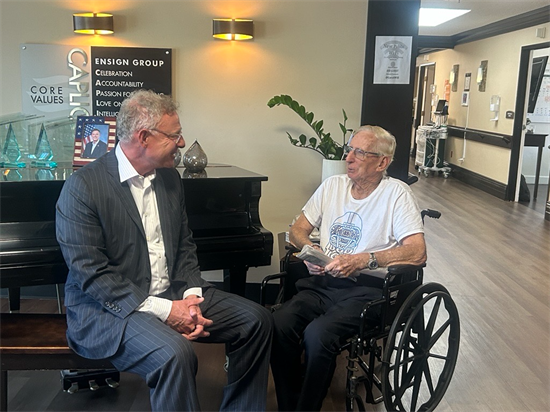 Rep. Peters speaks with a resident at a skilled nursing facility