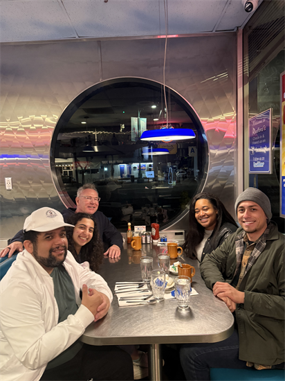 Rep. Peters and his staff eat breakfast after the Point-in-Time Count