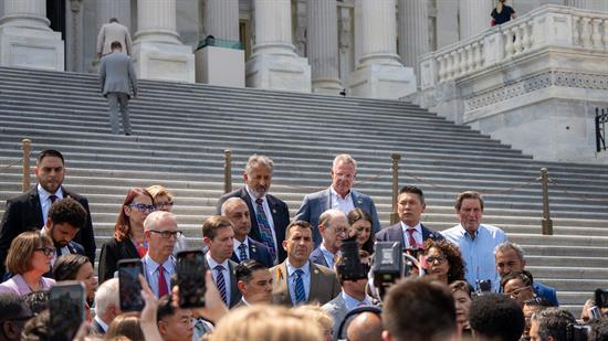 Rep. Peters and colleagues on the steps of the Capitol at a news conference.