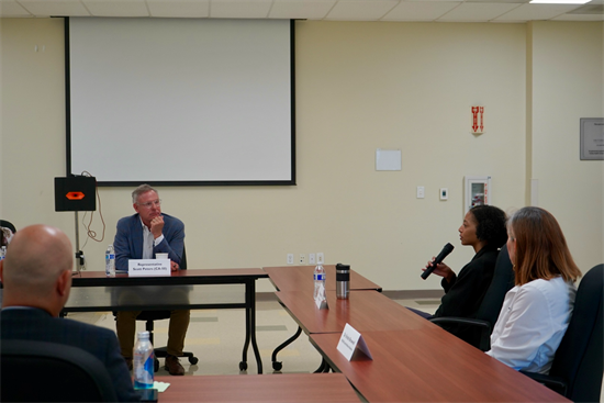 Rep. Peters listens to a doctor during the roundtable