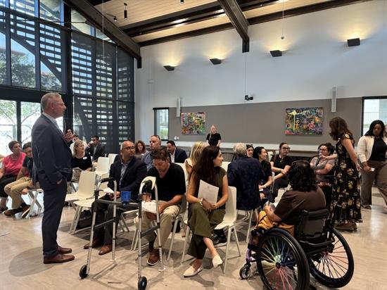 Rep. Peters speaks with people at a disability rights townhall